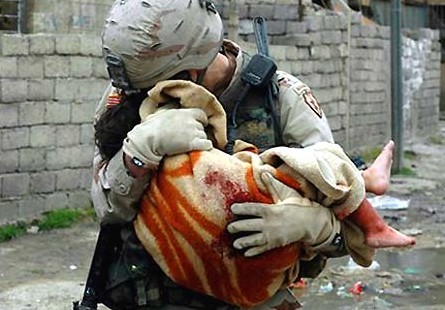 Afghanistan-US-soldier-holding-dead-baby Public Domain Via Wikimedia