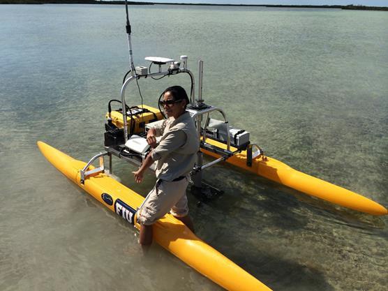 Unmanned surface vessel (USV) in Cudjoe Key deploying a submersible fluorometer to measure dye concentration