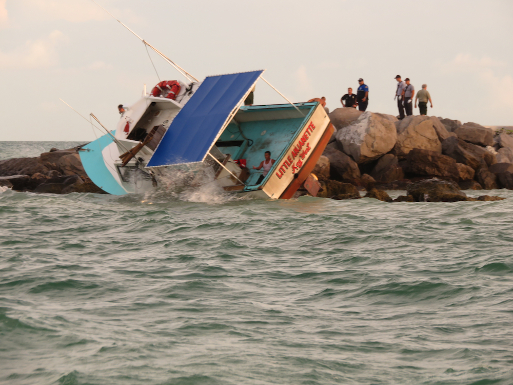 Mayday!! Fishing Boat Lands on Top of Rock Jetty [video]